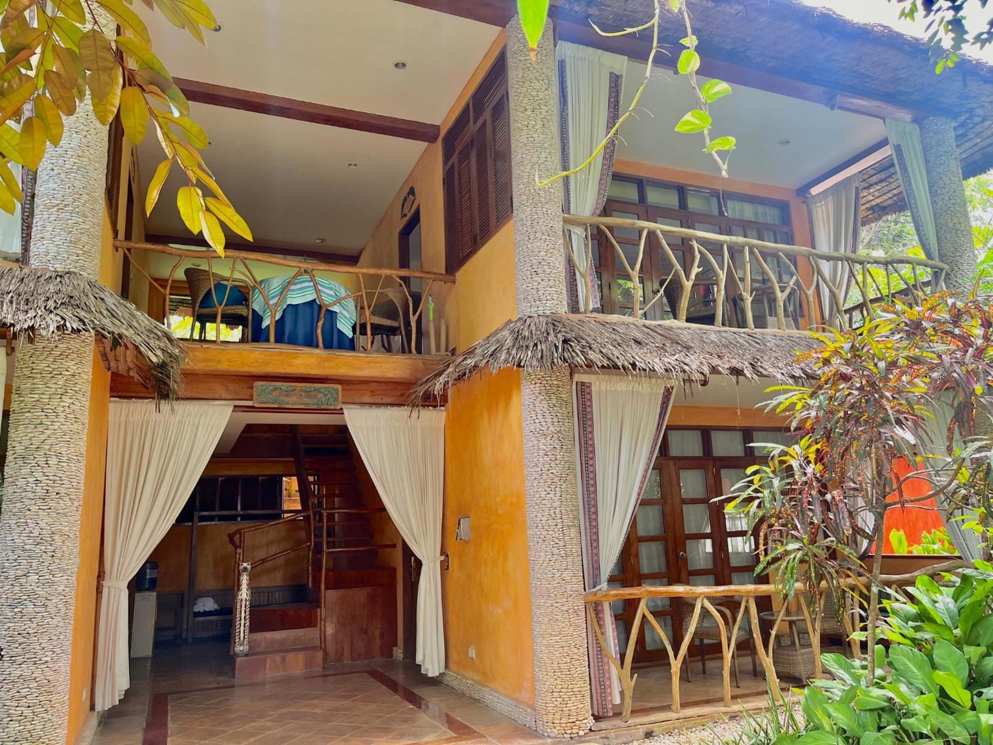 Coco Grove Beach Resort, Siquijor Island المظهر الخارجي الصورة A villa at the resort
